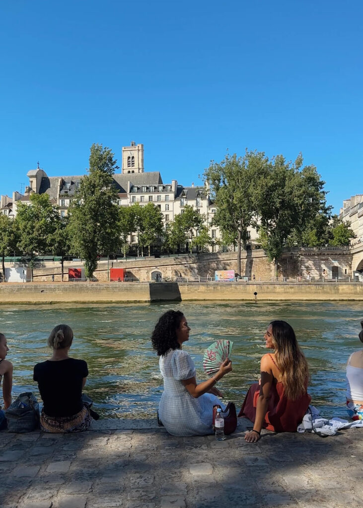 friends two women picnic by the seine paris