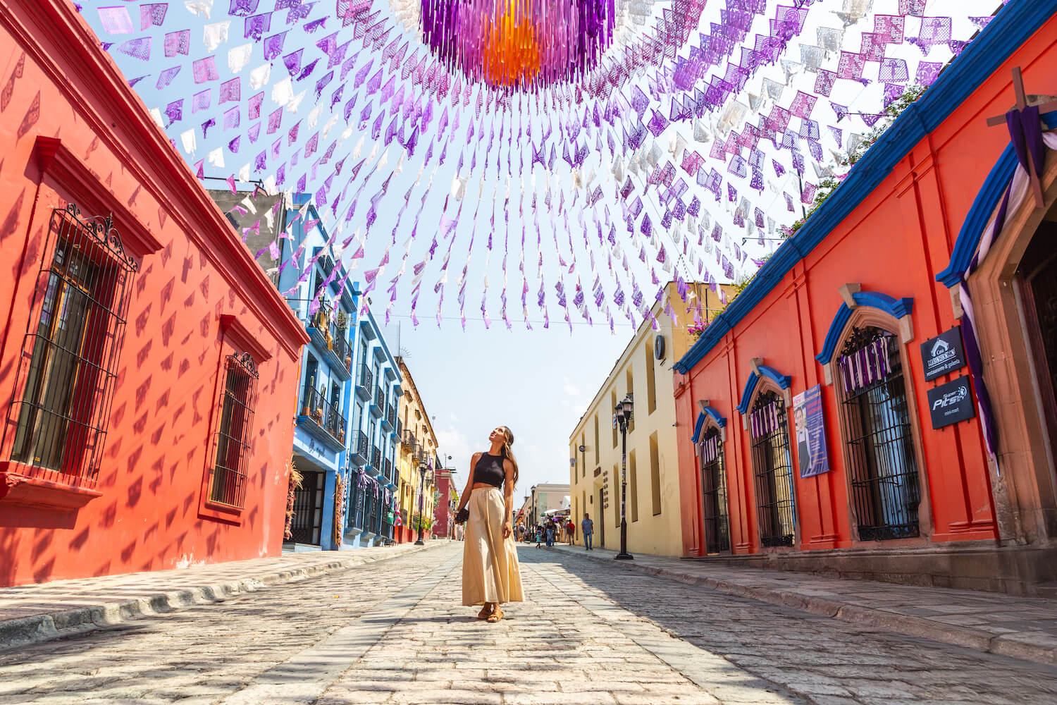 woman walking colourful oaxaca streets historic centro