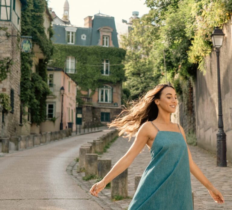 paris montmartre streets woman in dress twirling