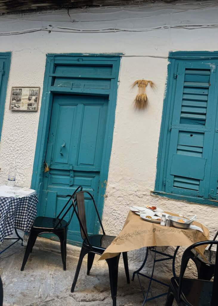 athens greece restaurant white walls blue door outdoor avli