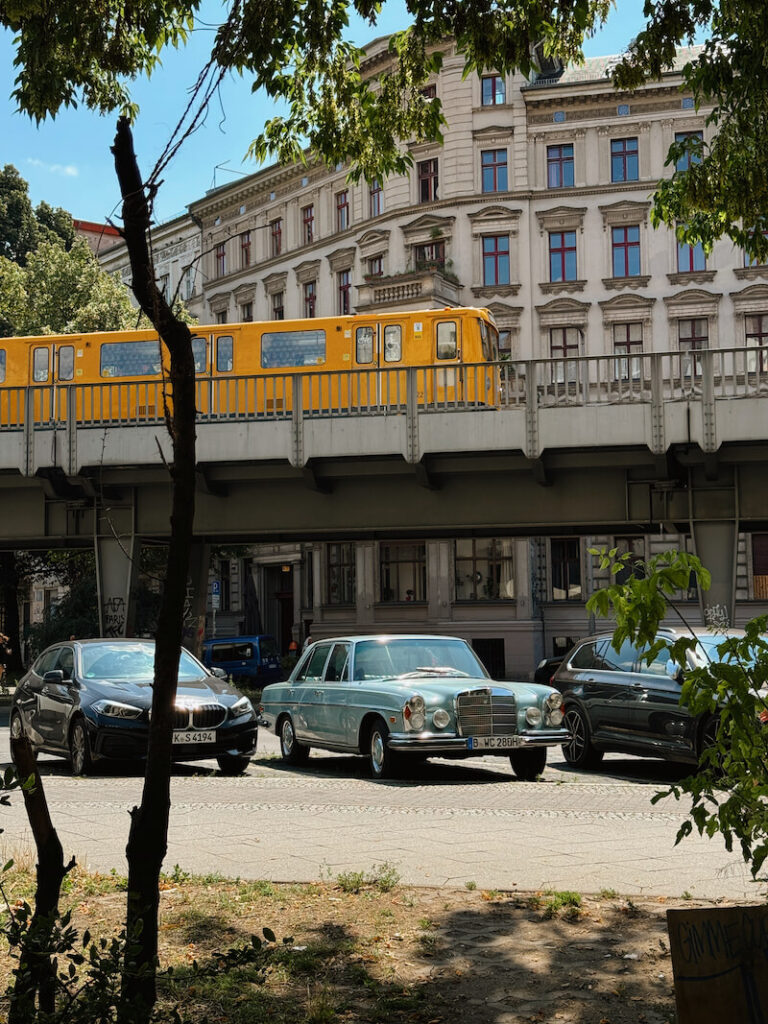 berlin kreuzberg old school car and yellow train