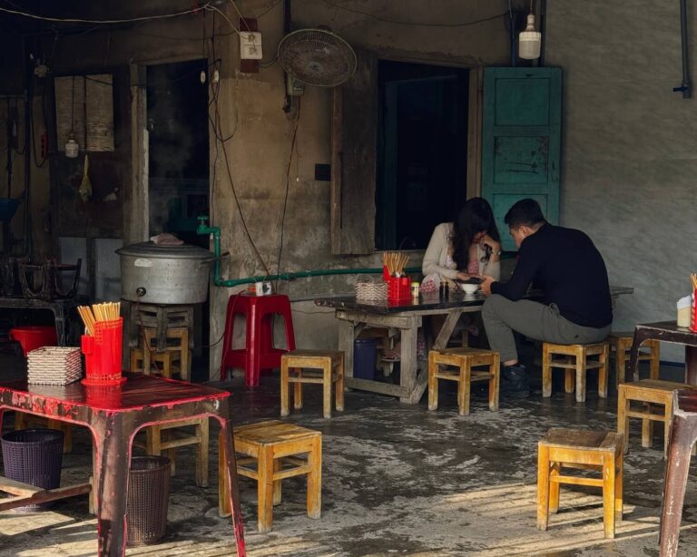 Traditional Vietnamese street-side restaurant in Hoi An, popular with locals