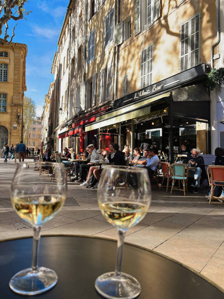 outdoor glass of wine in sunny square in Aix en Provence