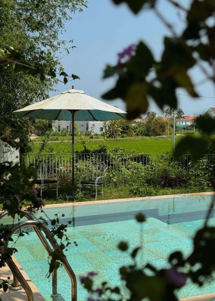 pool with rice field view in boutique hotel in hoi an vietnam