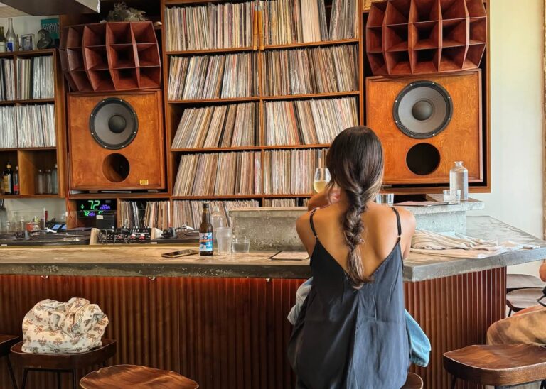 woman in local paris bar vinyl records