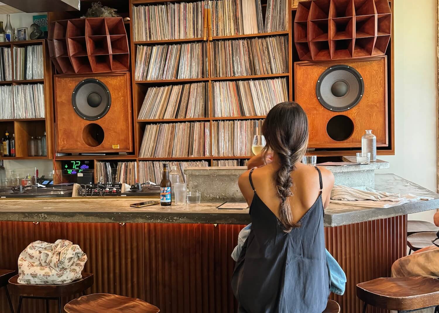 woman in local paris bar vinyl records